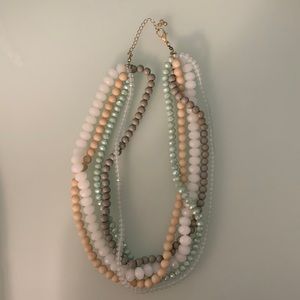 Multistrand neutrals and seafoam costume necklace with silver tone clasp